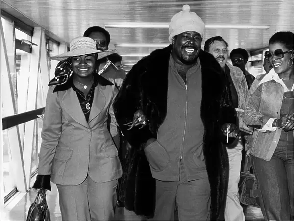 Barry White American soul singer arriving at Heathrow Airport with his wife Glodean White