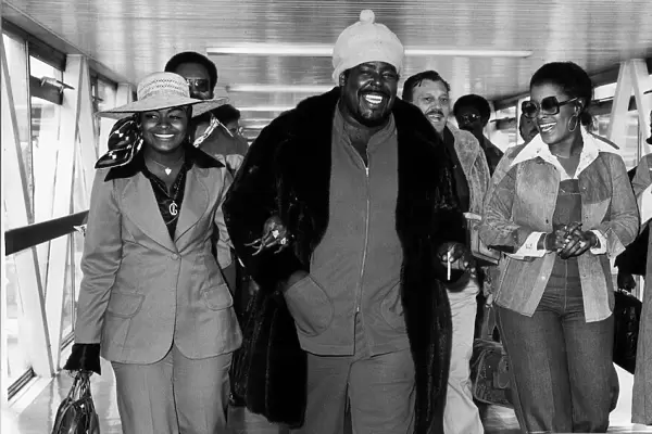 Barry White American soul singer arriving at Heathrow Airport with his wife Glodean White