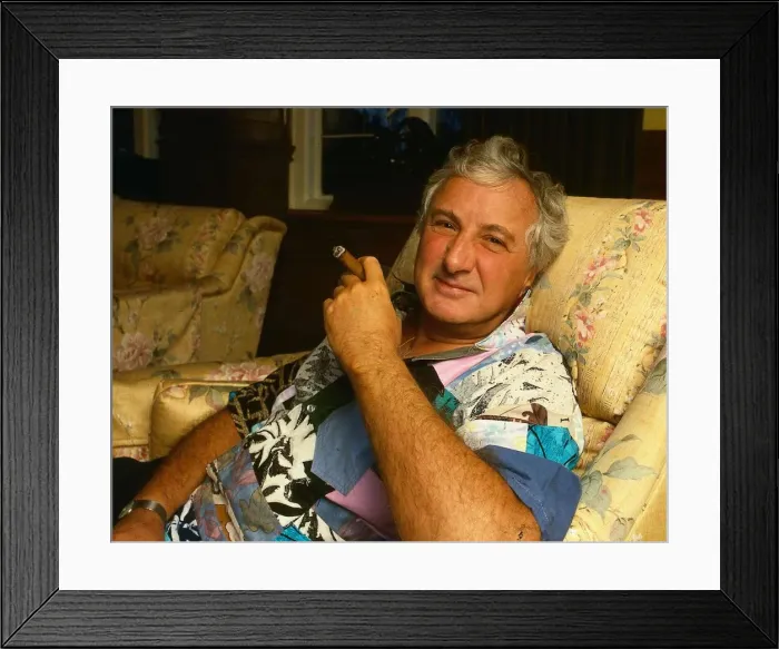 Framed Print : Michael Winner at home smoking cigar February 1988