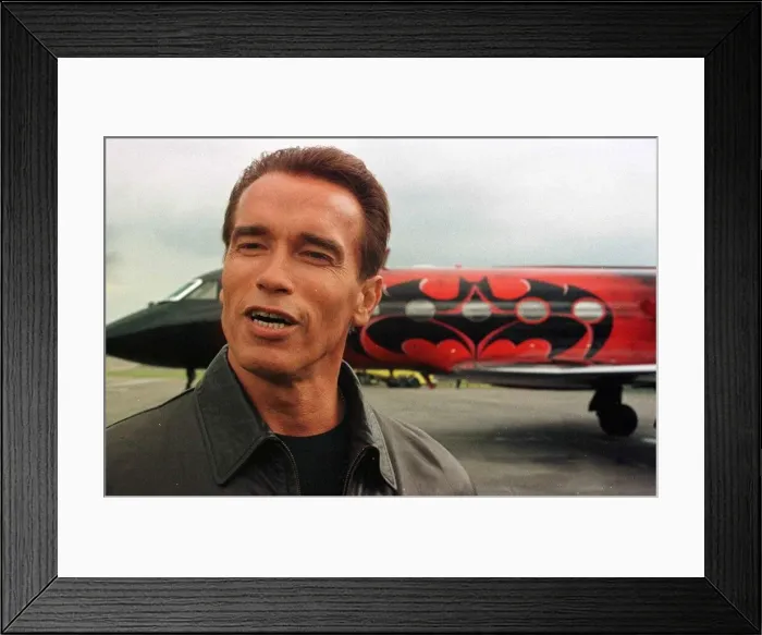 Framed Print : Arnold Schwarzenegger arrives at Luton Airport with wife Maria in Batplane Framed Print : Arnold Schwarzenegger arrives at Luton Airport with wife Maria in Batplane