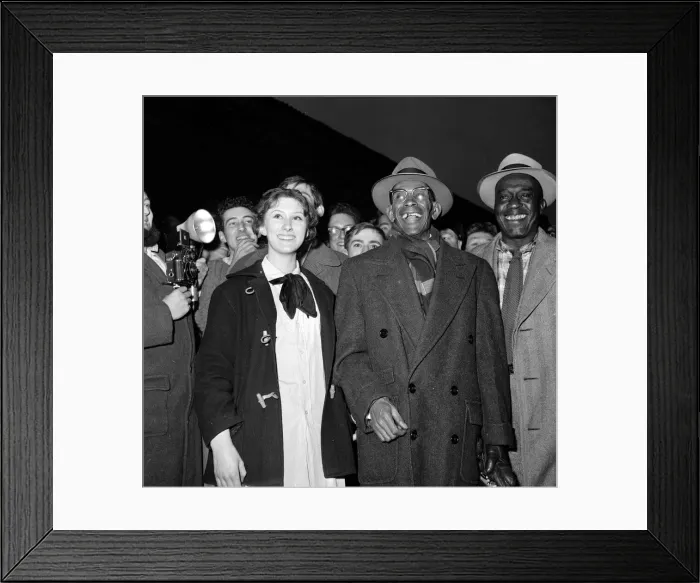 Framed Print : Jazz legend George Lewis arrives at Euston station, London