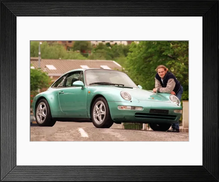 Framed Print : Actor Simon Weir poses by the Porsche Targa 911 car May 1997