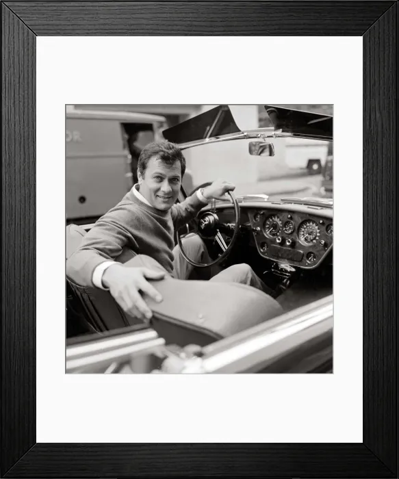 Framed Print : Tony Curtis, american actor poses for pictures in his Alvis TE21 motorcar in