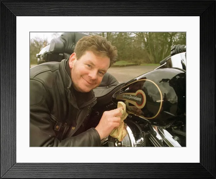 Framed Print : John Gordon Sinclair actor polishing his Harley Davidson Electra Glide motorcycle Framed Print : John Gordon Sinclair actor polishing his Harley Davidson Electra Glide motorcycle