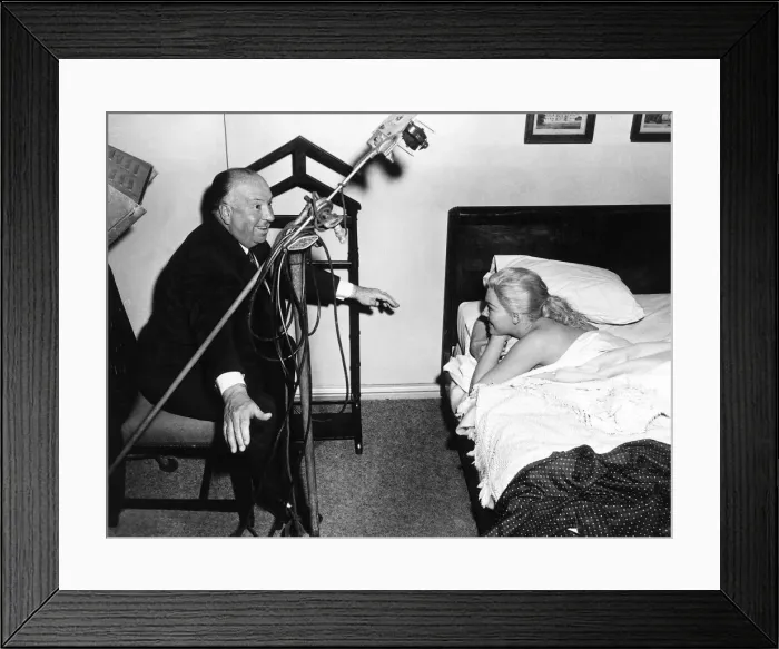 Framed Print : Alfred Hitchcock Film Director gives Kim Novak instructions July 1958 Framed Print : Alfred Hitchcock Film Director gives Kim Novak instructions July 1958
