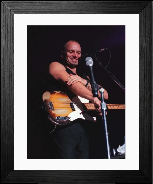 Framed Print : Sting rock singer on stage in Aberdeen commenting on how cold it is rubbing his arm with Framed Print : Sting rock singer on stage in Aberdeen commenting on how cold it is rubbing his arm with