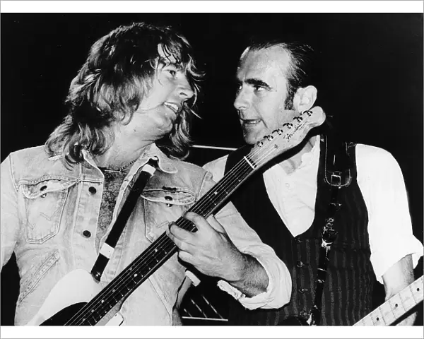 Status Quo POP Group Rick Parfitt and Francis Rossi singing on stage