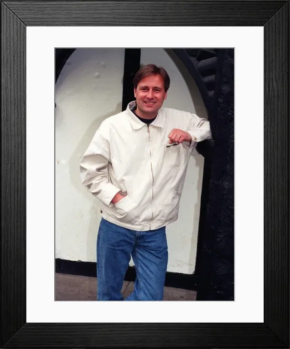 Framed Print : Gary Webster actor leaning against wall white jacket denims clenched fist April 1997 Framed Print : Gary Webster actor leaning against wall white jacket denims clenched fist April 1997