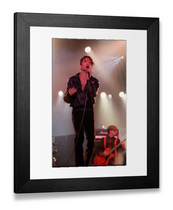 Framed Print : Jarvis Cocker of pop group Pulp singing into microphone on stage at T in the Park