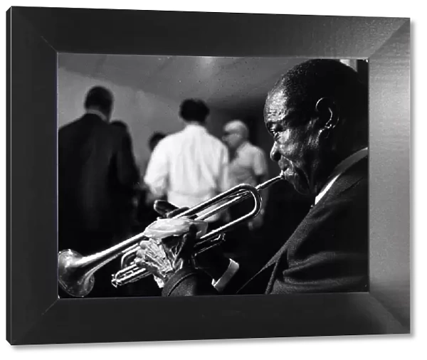 Louis Armstrong jazz trumpeter with trumpet, 1960s Local Caption retromusic