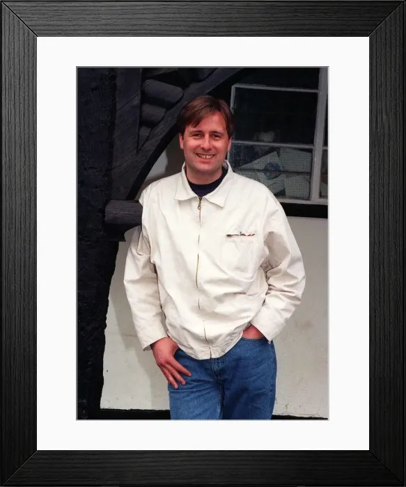 Framed Print : Gary Webster actor standing in archway white jacket denims hand in pocket April 1997 Framed Print : Gary Webster actor standing in archway white jacket denims hand in pocket April 1997