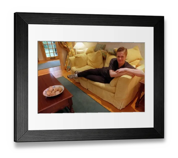 Framed Print : James MacPherson actor in Taggart Lying on settee March 1997