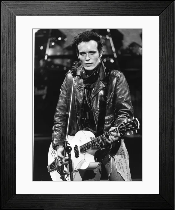 Framed Print : Adam Ant British pop singer playing guitar on stage 1985