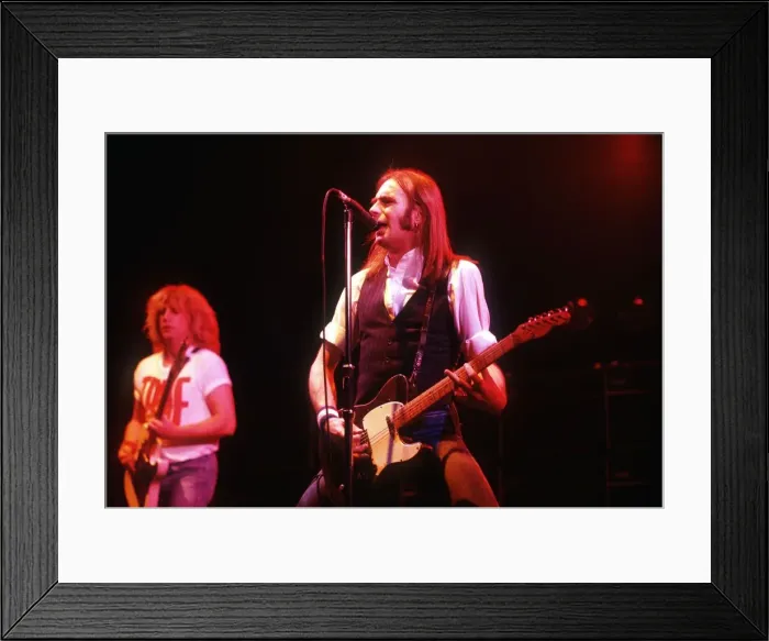 Framed Print : Francis Rossi playing at the Hammersmiths Odeon with his band Status Quo Framed Print : Francis Rossi playing at the Hammersmiths Odeon with his band Status Quo
