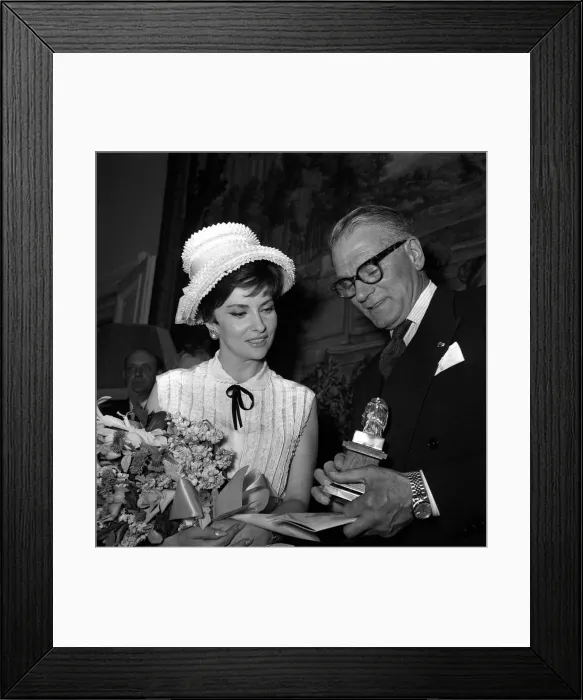 Framed Print : Laurence Olivier Actor May 1963 shows off his Olympus award to actress model Gina
