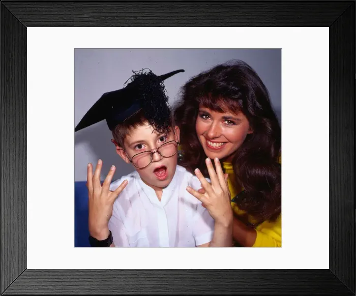 Framed Print : Debbie Greenwood TV presenter September 1986 with schoolboy Paul Cherry