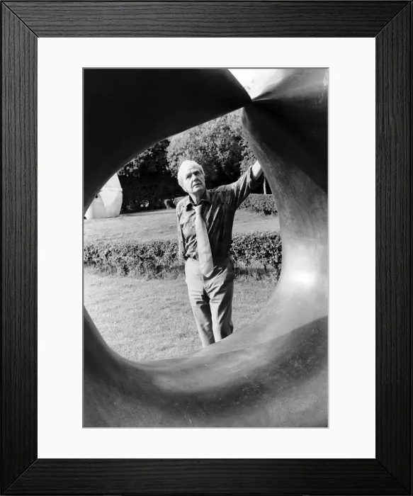 Framed Print : Henry Moore Artist Sculptor looks through one of his sculptures. 1978 Framed Print : Henry Moore Artist Sculptor looks through one of his sculptures. 1978