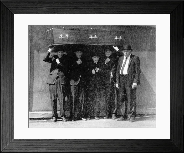 Framed Print : Furneral Directors using a coffin to stay dry as it pours down with rain Circa 1990 Framed Print : Furneral Directors using a coffin to stay dry as it pours down with rain Circa 1990