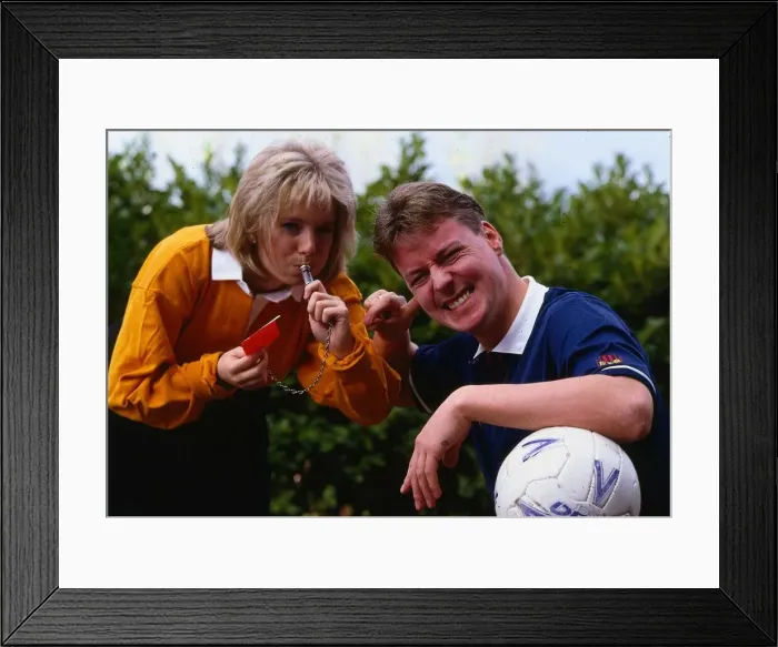 Framed Print : Hazel Irvine TV presenter September 1990 blowing a whistle into Jim Whites ear Framed Print : Hazel Irvine TV presenter September 1990 blowing a whistle into Jim Whites ear