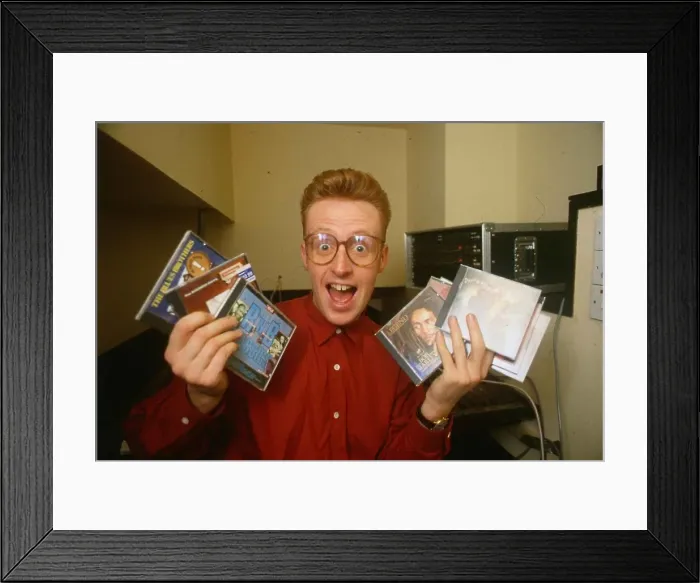 Framed Print : TV presenter Bryan Burnett holding various CD s Framed Print : TV presenter Bryan Burnett holding various CD s