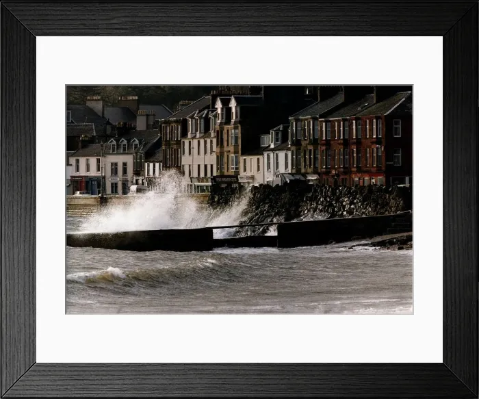 Framed Print : Waves crash against a wall at Millport in Scotland after heavy winds caused the sea to Framed Print : Waves crash against a wall at Millport in Scotland after heavy winds caused the sea to