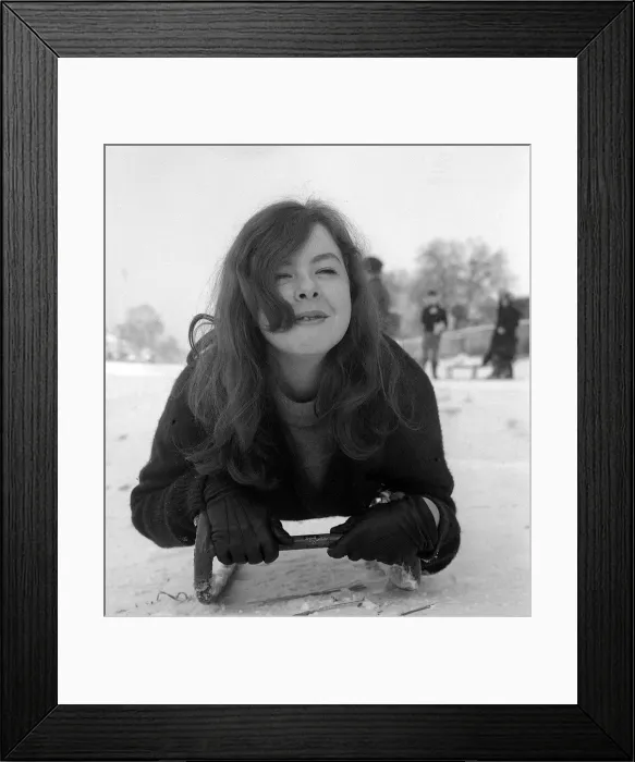Framed Print : 17 year old Jenny Kane of Hadley Wood rests on her sledge after Tobogganing on Hampstead