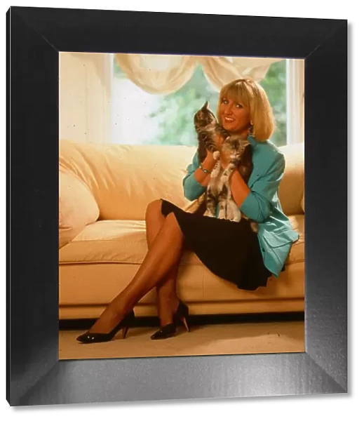 Jayne Irving TV presenter holding pet cat