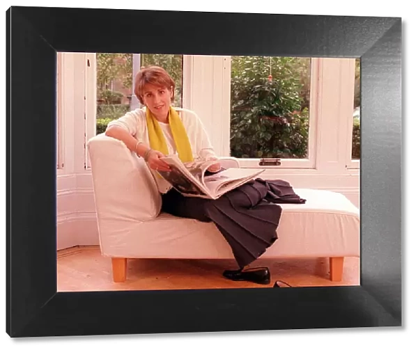 Kirsty Wark October 1999 TV Presenter reading a book on a sofa in her home
