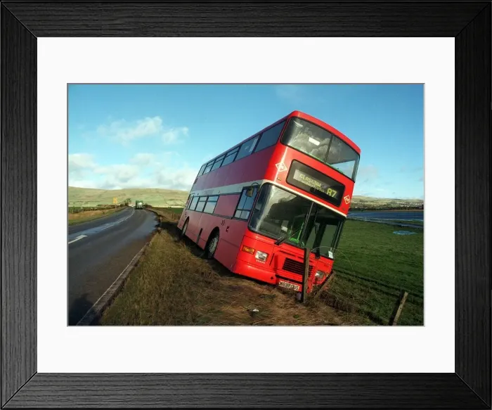 Framed Print : A red number 87 bus which was blown off the road at Kirkintilloch en route to Glasgow