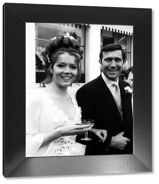 Actress Diana Rigg with George Lazenby getting married during the filming of '