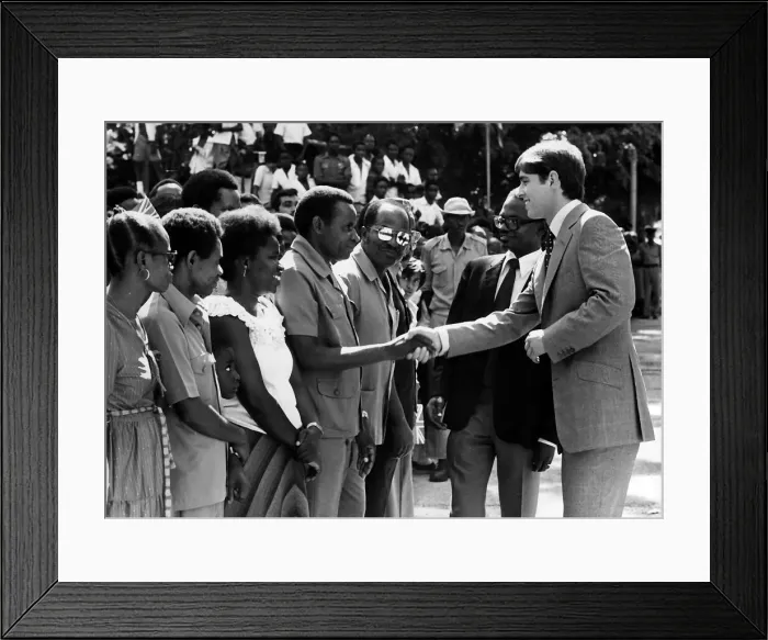 Framed Print : Prince Andrew at Dar Es Salaam during a visit to East Africa shaking hands with students Framed Print : Prince Andrew at Dar Es Salaam during a visit to East Africa shaking hands with students