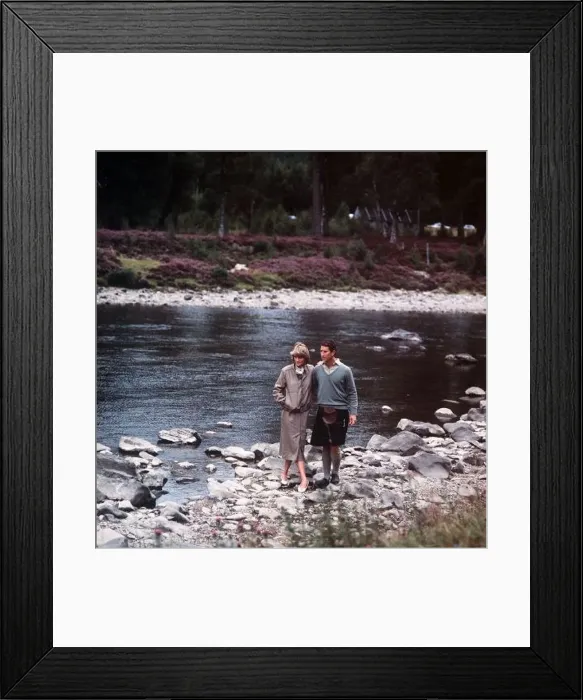 : Prince Charles and Princess Diana walk along the River Dee at Balmoral : Prince Charles and Princess Diana walk along the River Dee at Balmoral