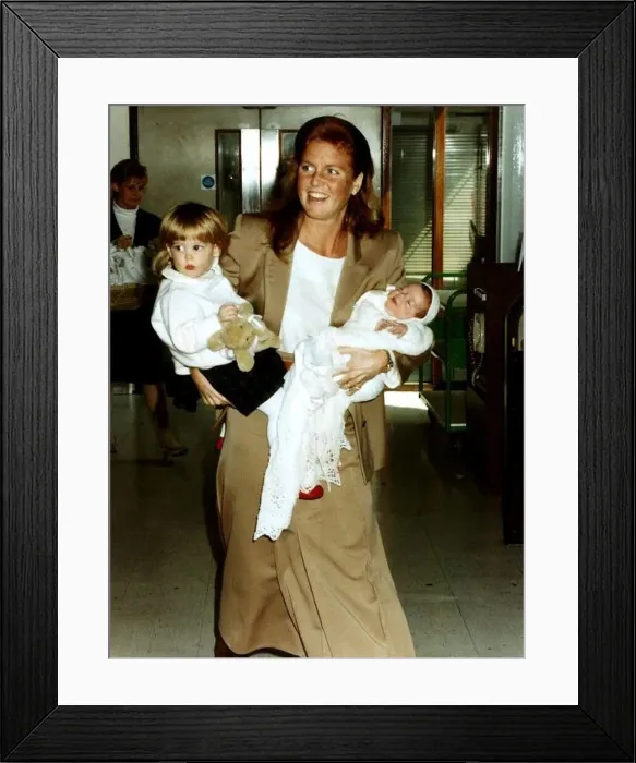 : Princess Eugenie and Princess Beatrice being held by their mother the Duchess Of York : Princess Eugenie and Princess Beatrice being held by their mother the Duchess Of York