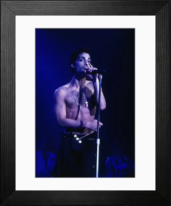 Framed Print : Singer Prince August 1986 on stage bare chested singing into microphone at Wembley Framed Print : Singer Prince August 1986 on stage bare chested singing into microphone at Wembley