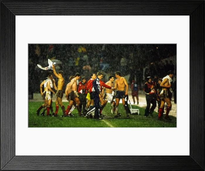 Framed Print : Scotland players leave pitch in heavy rain following their World Cup qualifier against Framed Print : Scotland players leave pitch in heavy rain following their World Cup qualifier against