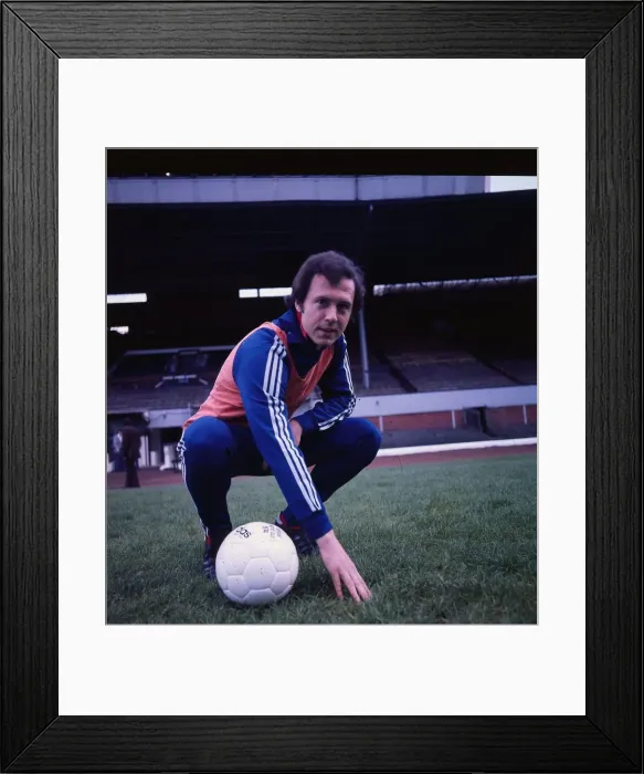 Framed Print : Franz Beckenbauer former West German football player May 1976 crouching training gear Framed Print : Franz Beckenbauer former West German football player May 1976 crouching training gear