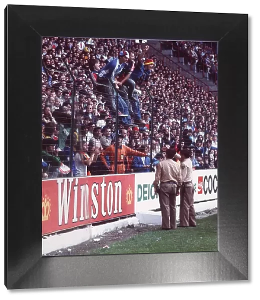 West Germany v Chile fans World Cup 1982 football supporters standing on fence police
