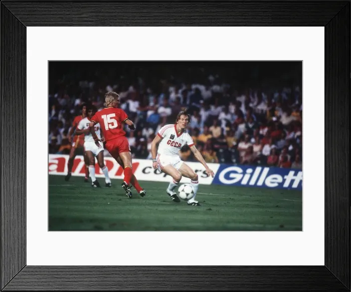 Framed Print : Belgium v Russia 1982 World cup match Oleg Blokhin out smarts Marice De Framed Print : Belgium v Russia 1982 World cup match Oleg Blokhin out smarts Marice De