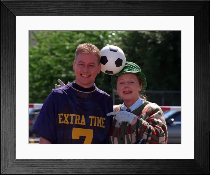 Framed Print : Jim White with Gwyneth Guthrie (Mrs Mack) with football balanced between their heads Framed Print : Jim White with Gwyneth Guthrie (Mrs Mack) with football balanced between their heads