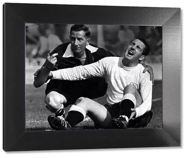 Dave Mackay Spurs football player September 1964 Lie on ground with broken leg