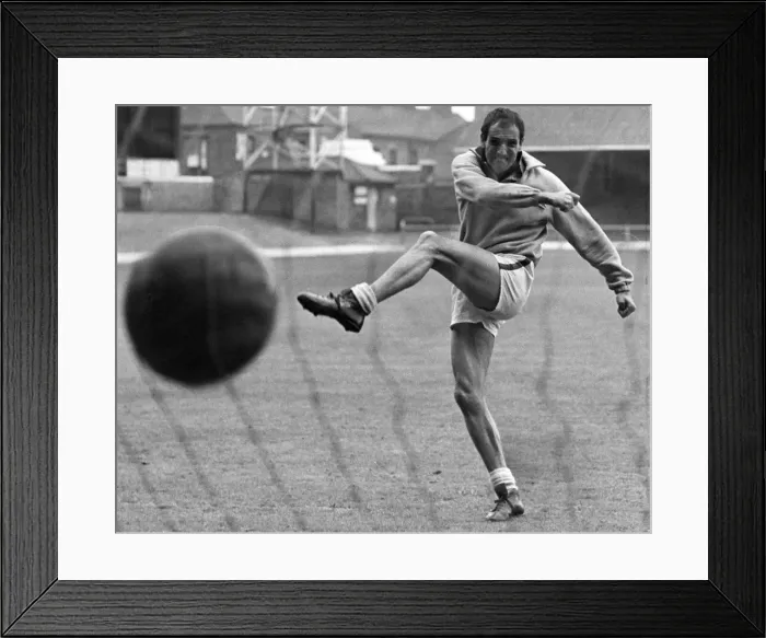 Framed Print : Derek Dougan Leicester City football player fires in a shot during training session ahead Framed Print : Derek Dougan Leicester City football player fires in a shot during training session ahead