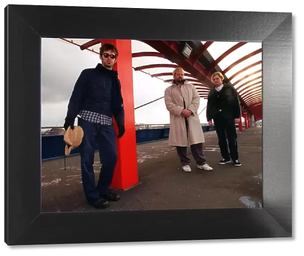 The Eels pop group standing in covered walkway Scottish Exhibition Centre 1997