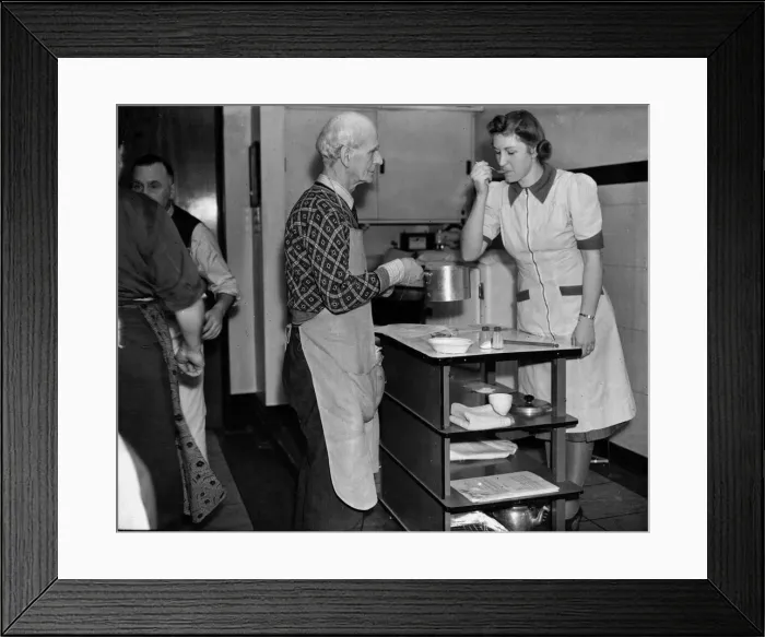 Framed Print : Mens cooking class, February 1944 An elderly man has his food tasted by one Framed Print : Mens cooking class, February 1944 An elderly man has his food tasted by one