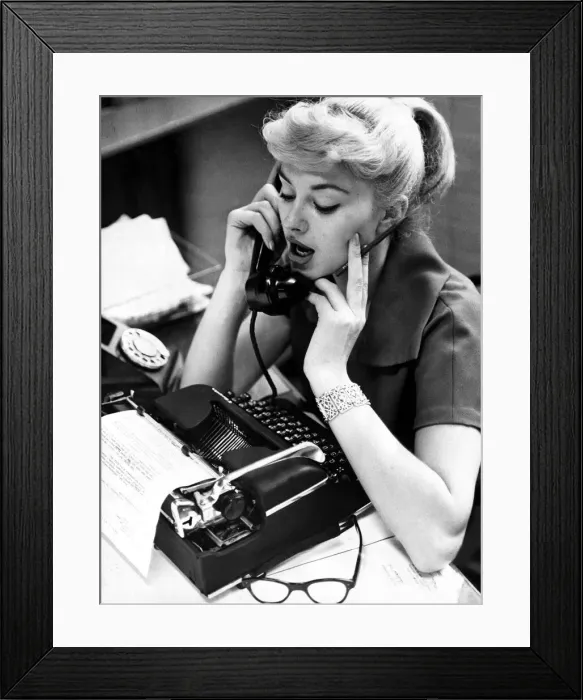 Framed Print : Office worker on the phone holding pencil, September 1958 Framed Print : Office worker on the phone holding pencil, September 1958