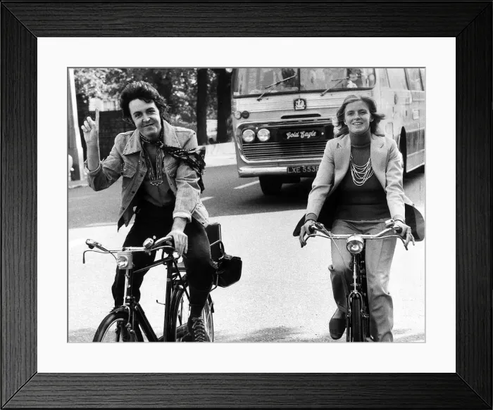 Framed Print : Paul McCartney former singer with The Beatles with wife Linda out riding bicycles Framed Print : Paul McCartney former singer with The Beatles with wife Linda out riding bicycles