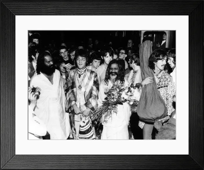 Framed Print : The Beatles with the Maharishi Mahesh Yogi who is clutching bundles of flowers Beatles