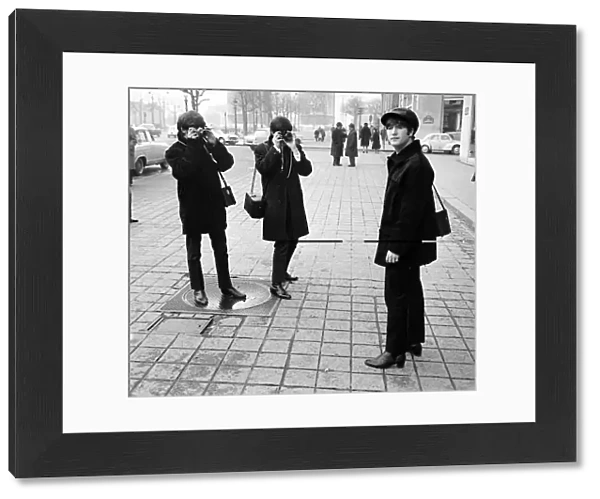 The Beatles on the Champs Elysees before Ringo arrived in Paris later in the day