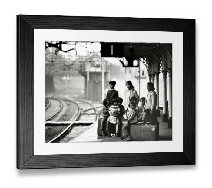Framed Print : Asian immigrant family waiting at Bishops Stortford train station to travel to London Framed Print : Asian immigrant family waiting at Bishops Stortford train station to travel to London