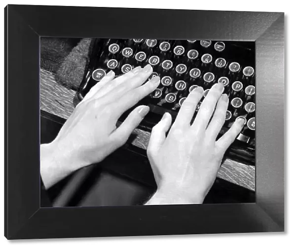 Female hands typing on typewriter October 1949