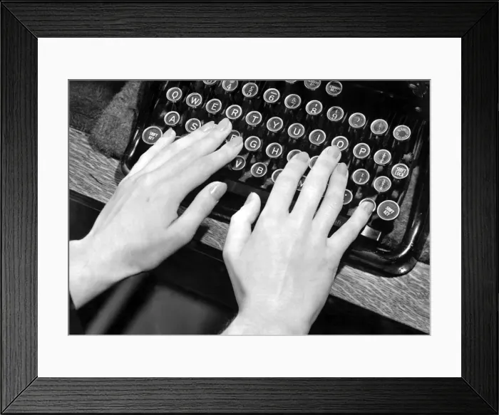 Framed Print : Female hands typing on typewriter October 1949